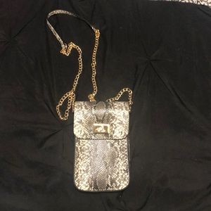 A long crossbody phone pouch.